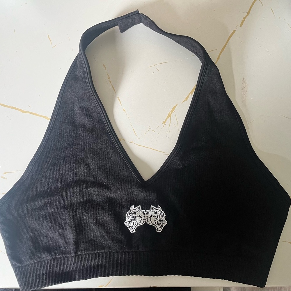 She Wolfs forever halter sports bras. Never used. Too big for me